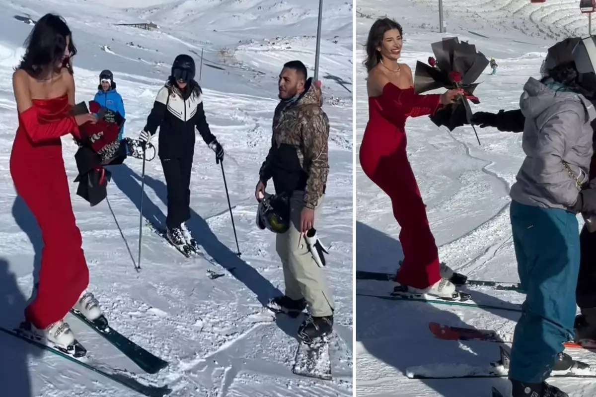 Kırmızı elbisesiyle Erciyes'te kayak yapıp, gül dağıttı
